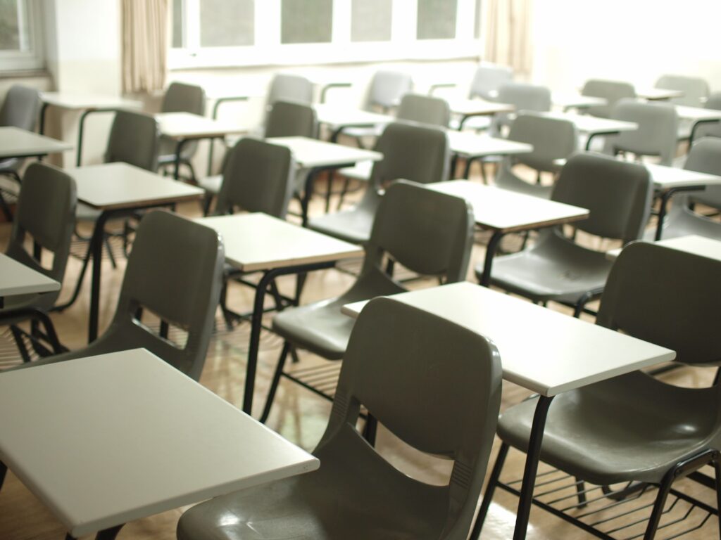 Photo of classroom desks by MChe Lee on Unsplash.